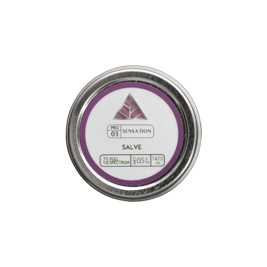 Aluminum circular tin of Color Up Sensation Salve with a label on a white background.