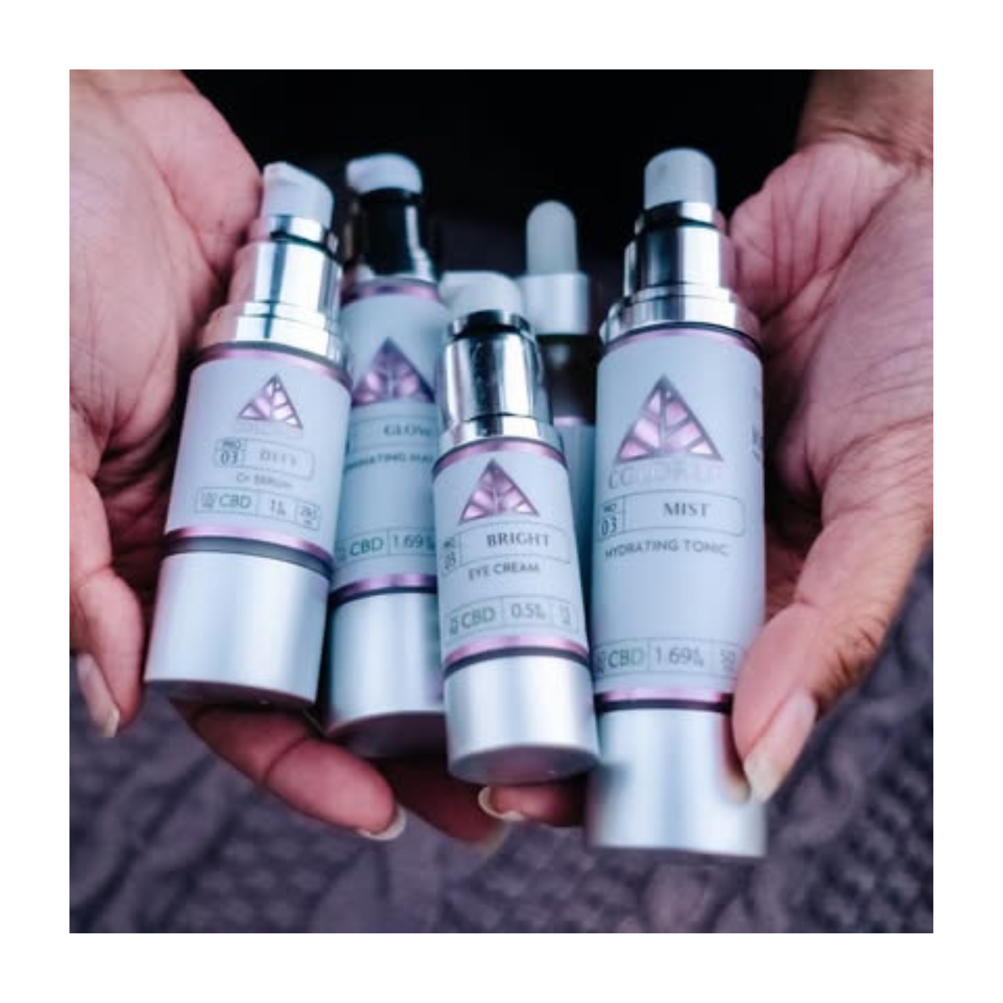 Color Up professional skincare essentials held in hand, featuring Defend Serum, Glow Mask, Bright Eye Cream, and Mist Hydrating Tonic for a complete botanical facial routine.