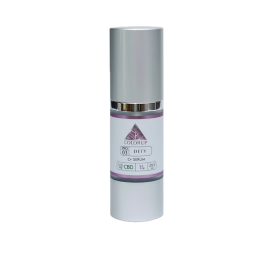 DEFY C+ Serum bottle with 'Color Up' pink logo on silver cosmetic bottle with transparent background